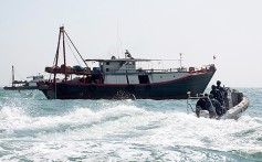 A Hong Kong marine police crew intercept a trawler operating illegally in waters. photo: SCMP Pictures