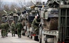 Ukrainian soldiers transport tanks from their base near Simferopol, Crimea on Wednesday. Photo: AP