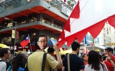 A protester dons a mask showing the face of lawmaker Jeffrey Lam. Photo: Fanny Fung