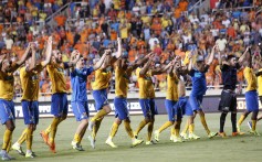 Players of Apoel Nicosia celebrated their win during a third qualifying round, second leg soccer match against FC Midtjylland at GSP stadium, in Nicosia. Photo: AP 