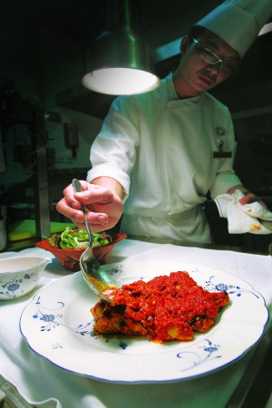 A chef at Sands Macao preparing African chicken