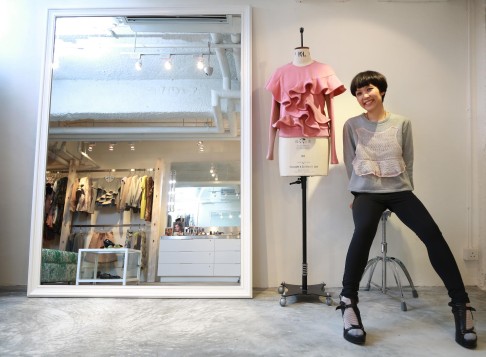 Johanna Ho poses next to one of her creations at her store. Photo: Herbert Tsang
