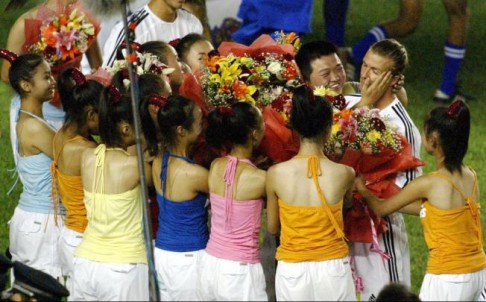 In 2003, with Real Madrid, David Beckham was mobbed by admirers in Beijing. Photo: Reuters