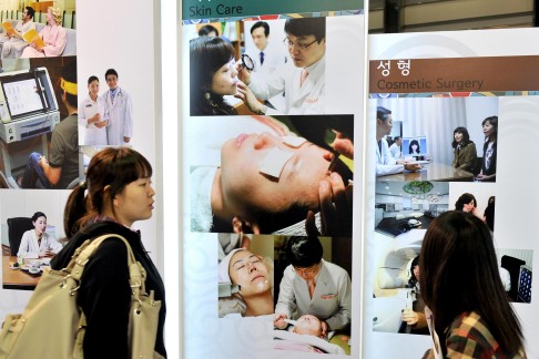 Advertisements for a medical tourism expo in Seoul, one of the plastic surgery capitals of the world. Photo: AFP