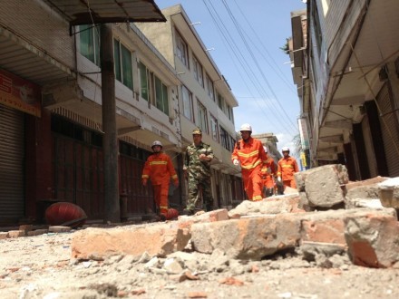 Rescuers inspect buildings along a street in Longmenxiang, near the epicentre of the earthquake. Photo: Simon Song