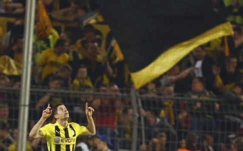 Robert Lewandowski celebrates his third goal for Borussia Dortmund against Madrid in the Champions League semis. Photo: Reuters