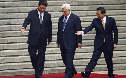 China's President Xi Jinping (left) greets Palestinian counterpart Mahmoud Abbas in Beijing. Photo: Reuters