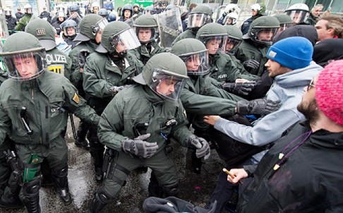 Anti-globalization protesters scuffle with police in the centre of Frankfurt, Germany, on Friday. Photo: EPA