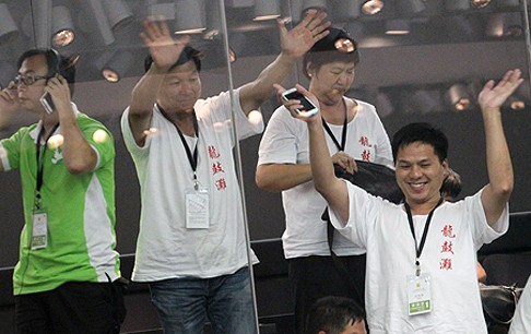 Tuen Mun residents in the Legislative Council gallery celebrate the voting results on the motions to end the landfill debate. Photo: Felix Wong