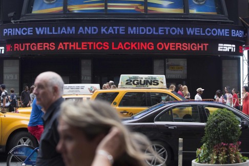 A news ticker in Times Square in New York announces the birth of the royal baby. Photo: Reuters