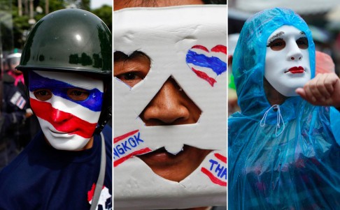 Members of the 'V for Thailand' political group wore a variety of face masks during their rally to protest against the amnesty bill. Photos: EPA, Reuters