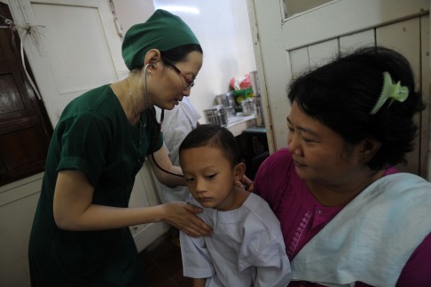 A young boy getting checked by a doctor before an operation at the Muslim Free Hospital. Photo: AFP