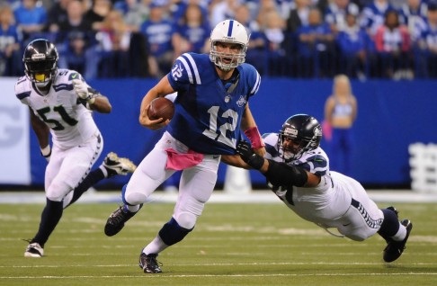  Colts quarterback Andrew Luck is taken down by Jordan Hill, of the Seattle Seahawks. Photo: AFP