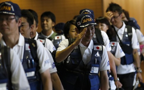Members of the Japan Disaster Relief Medical Team depart. Photo: Reuters