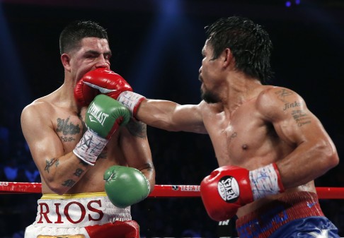Manny Pacquiao, from the Philippines, right, lands a right to Brandon Rios of the United States during their WBO international welterweight title fight Sunday. Photo: AP