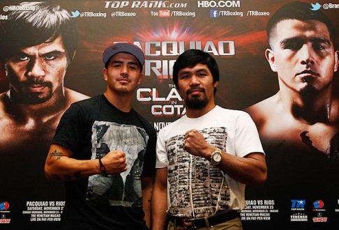 Filipino boxing icon Manny Pacquiao (right) and Brandon Rios of the US pose during a news conference in Singapore. Photo: Reuters