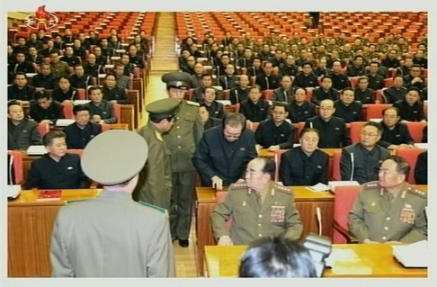 A still image taken from North Korea's state-run KRT television footage shows Jang Song Thaek being forcibly removed from a WPK meeting in Pyongyang.