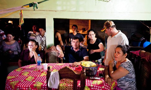 Family watch the broadcast of the arrival of pacific castaway Jose Salvador Alvarenga at their house in Garita Palmera, El Salvador, on Tuesday. Photo: AFP