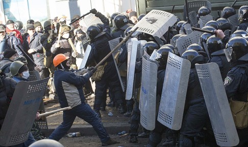 Interior Ministry members clash with anti-government protesters during a rally in Kiev on Tuesday. Photo: Reuters