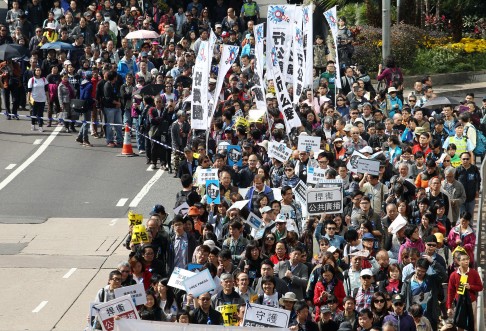 Journalists and their supporters march to the Chief Executive's Office yesterday. Photo: Felix Wong