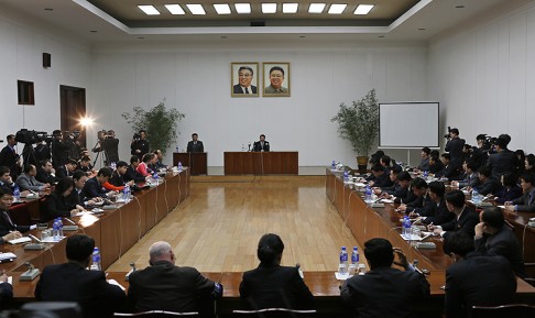 Kim Jeong-wook (centre in the background) speaks under the portraits of late leaders Kim Il-sung and Kim Jong-il during a news conference in Pyongyang, North Korea, on Thursday. Photo: AP