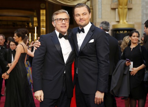 Leonardo DiCaprio greets actor Christoph Waltz on the red carpet. Photo: Reuters