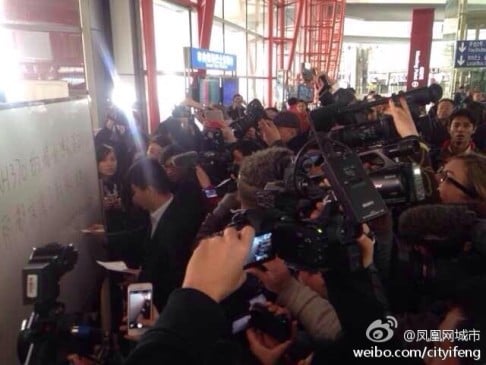 Reporters and relatives waiting at the Beijing airport on Saturday. Photo: Weibo screenshot