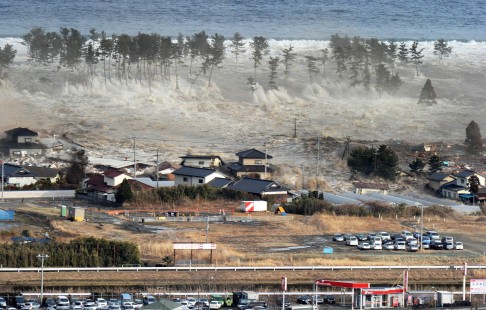 Houses are swept away by the devastating tsunami that hit Japan on March 11, 2011. Photo: EPA