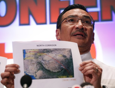 Malaysia's acting Transport Minister Hishamuddin Hussein shows maps of the northern search corridor. Photo: AP