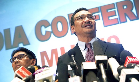 Malaysia's acting Transport Minister Hishammuddin Hussein speaks about the missing Malaysia Airlines flight MH370 at Kuala Lumpur International Airport. Photo: Reuters<br />
