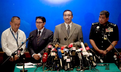 Malaysia's acting transport minister, Hishammuddin Hussein (second right), during yesterday's press briefing. He said experts had been recruited to examine the pilot's flight simulator. Photo: AFP