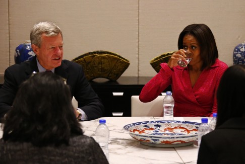 U.S. first lady Michelle Obama drinks water as U.S. Ambassador to China Baucus speaks during a roundtable on the topic of education at the U.S. Embassy in Beijing. Photo: Reuters