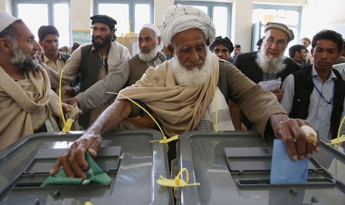 An Afghan man casts his vote at a polling station in Jalalabad on Saturday. Photo: AP