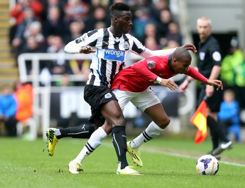 Newcastle's Massadio Haidara (left) vies for the ball with Manchester United's Ashley Young in a match the Red Devils won 4-0. Photo: AP 