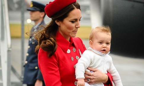 Catherine, the Duchess of Cambridge, steps off the airplane with Prince George in her arms at the Wellington international airport on Monday. Photo: AFP