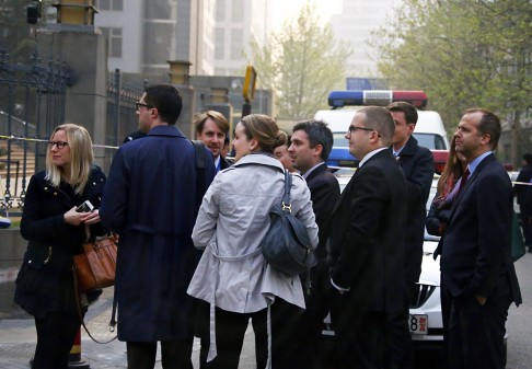 Diplomats stand outside the court where the activists are on trial. One European diplomat said one protester yelled "Ding Jiaxi is innocent!” before being hauled away by police. Photo: Reuters