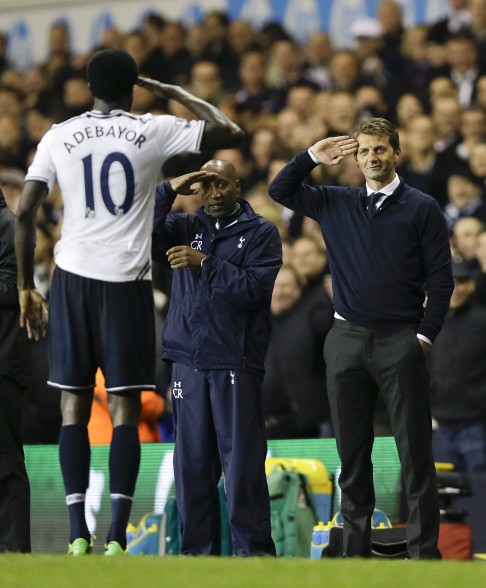 Tottenham's Emmanuel Adebayor, left, salutes to manager Tim Sherwood, right, after he scores Photo: AP