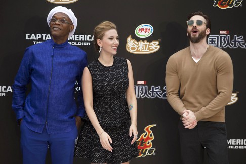 Actress Scarlett Johansson stands next Samuel Jackson (left) and Chris Evans (right) during a publicity event in Beijing on March 24, 2014. Photo: AP