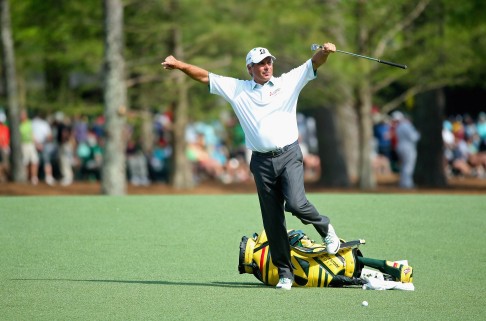 Fred Couples loosens up before hitting a shot at the 13th hole. Photo: AFP