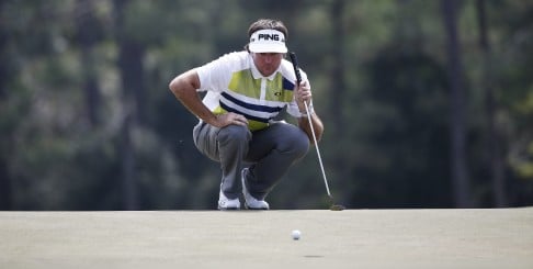 Bubba Watson lines up his putt on the 18th hole, which he missed. Photo: EPA