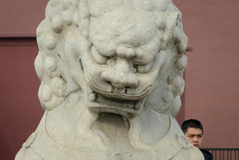 A lion outside the Forbidden City, parts of which date back six centuries. Photo: AFP