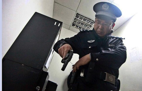 Police will carry revolvers in response to the attack. Photo: Xinhua