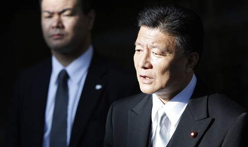 Japan's Internal Affairs and Communications Minister Yoshitaka Shindo speaks to the media after visiting the Yasukuni Shrine. Photo: Reuters
