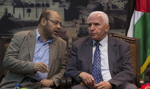 Hamas deputy leader Musa Abu Marzuk (left) speaks with the head of the delegation of the PLO Azzam al-Ahmad. Photo: AFP