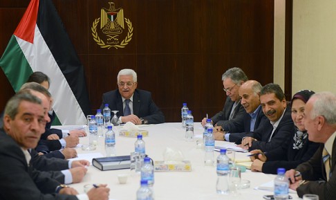 Palestinian president Mahmoud Abbas (centre) with members of his Fatah movement in the West Bank city of Ramallah on Monday. Photo: AFP