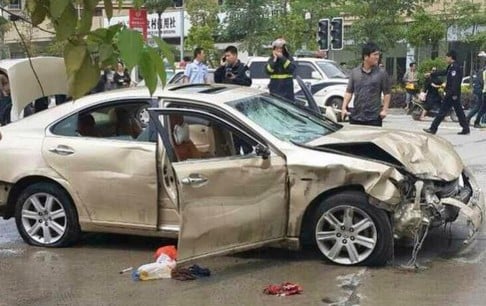 The driver had to be forced out of his badly damaged car with a water cannon. Photo: SCMP