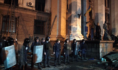Police stand guard in front of the burned Trade Union building in Odessa late on Friday. Photo: AFP