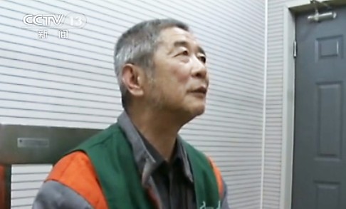 Xiang Nanfu, apologising on state television for "publishing false stories" after being detained in Beijing. Photo: AFP