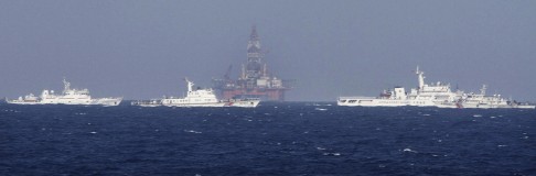 The oil rig at the centre of the dispute surrounded by Chinese coastguard ships. Photo: Reuters