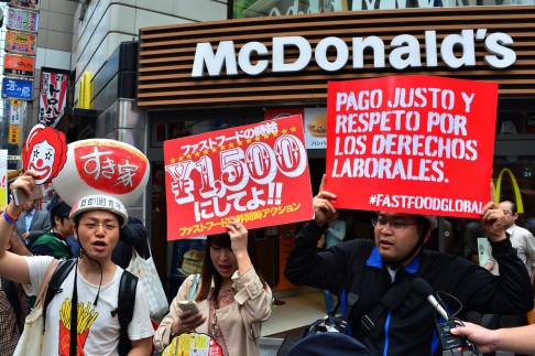 Tokyo workers join the protests. Photo: AFP